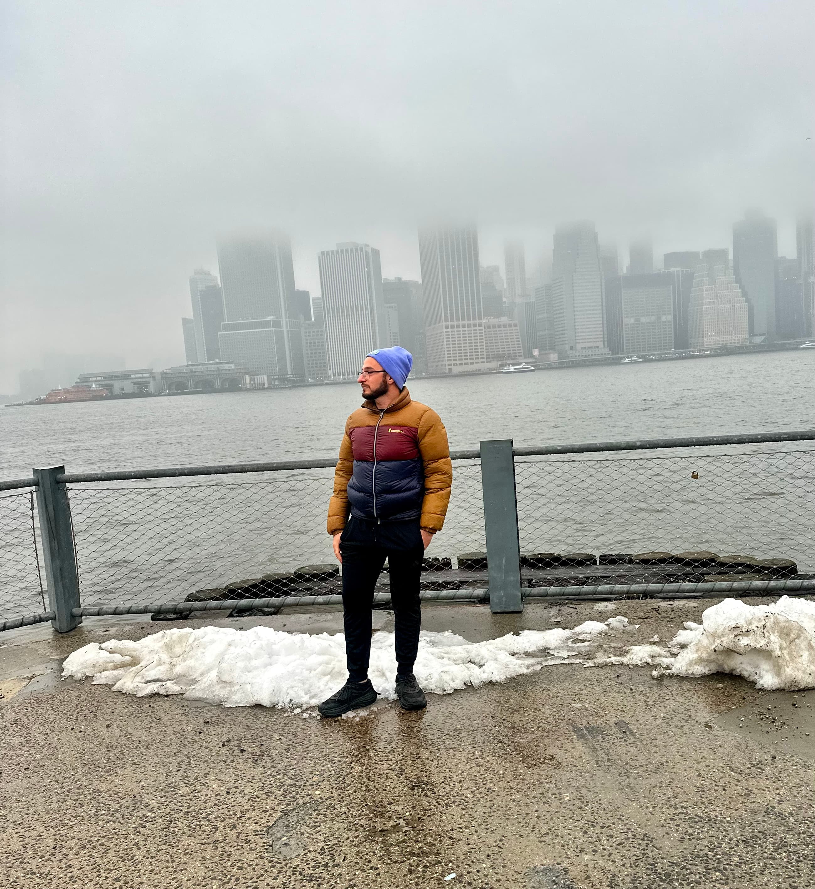 Shawn Levi, founder of Levi Tool & Co, standing at a waterfront with the NYC skyline